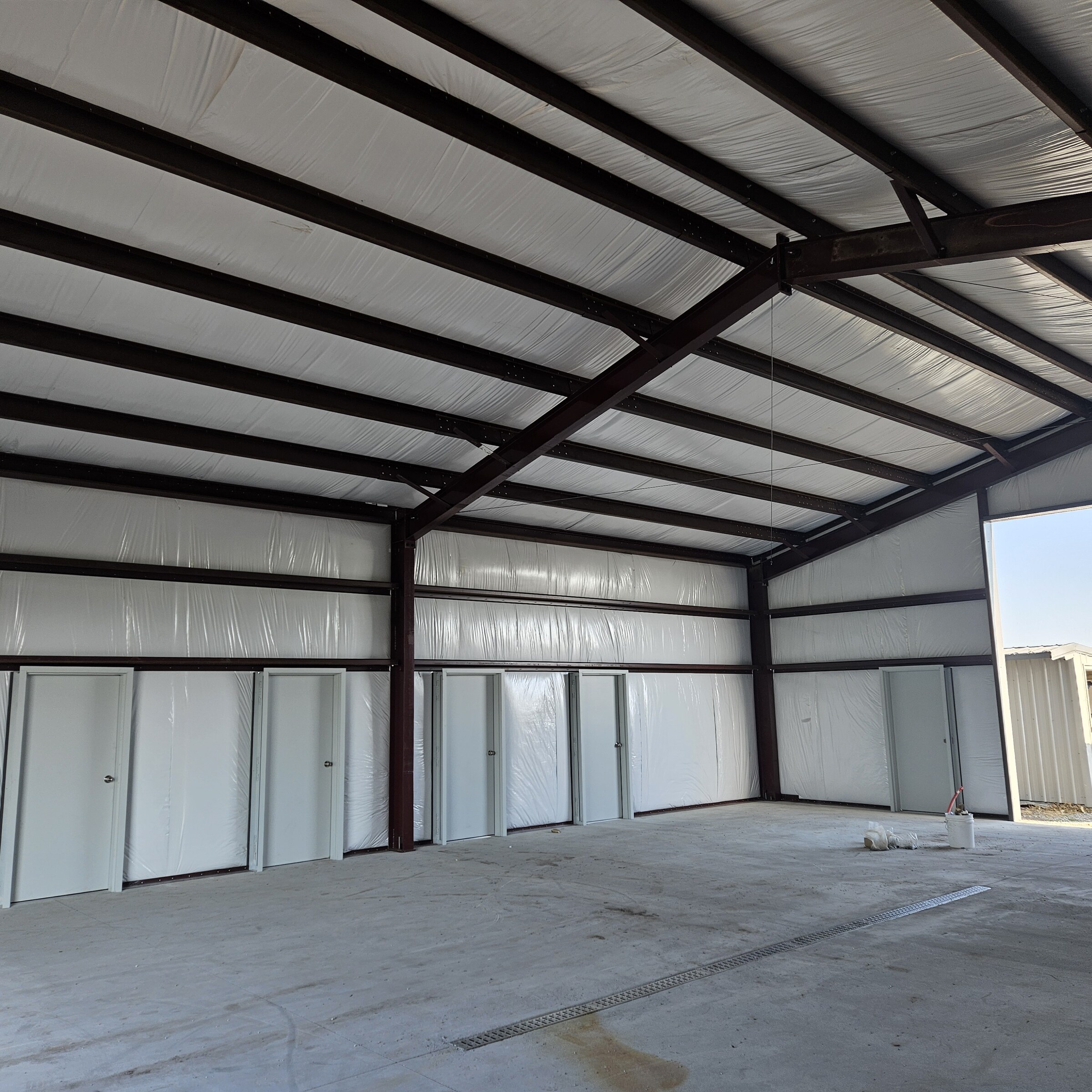 Interior of a metal building with insulated walls and roof panels